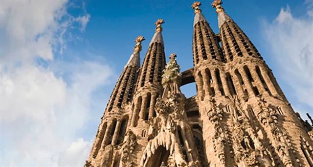 Close view of the carved stone spires of the Sagrada Familia basilica in Barcelona