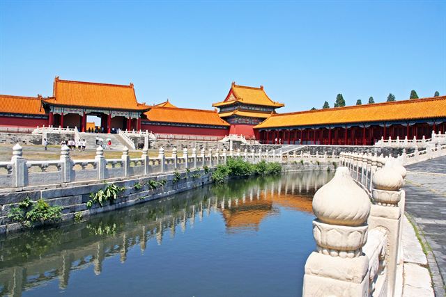 Forbidden City palace halls and moat with white marble balustrades in Beijing