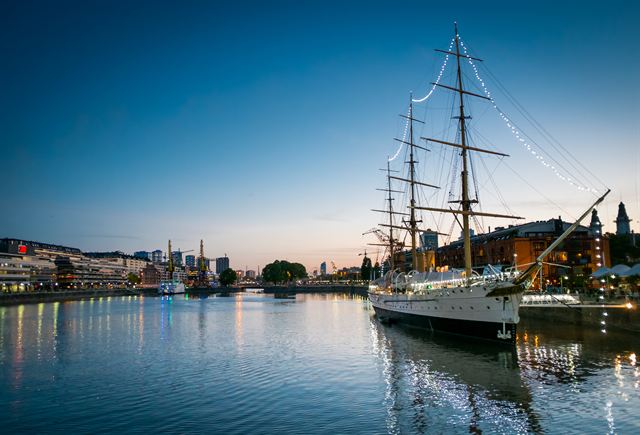 Historic tall ship Fragata Presidente Sarmiento moored in Puerto Madero at dusk, Buenos Aires