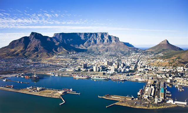 Aerial view of Cape Town harbour and city center below Table Mountain, Lion’s Head and Devil’s Peak