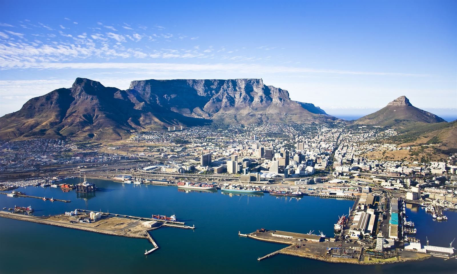 Aerial view of Cape Town harbour and city center below Table Mountain, Lion’s Head and Devil’s Peak