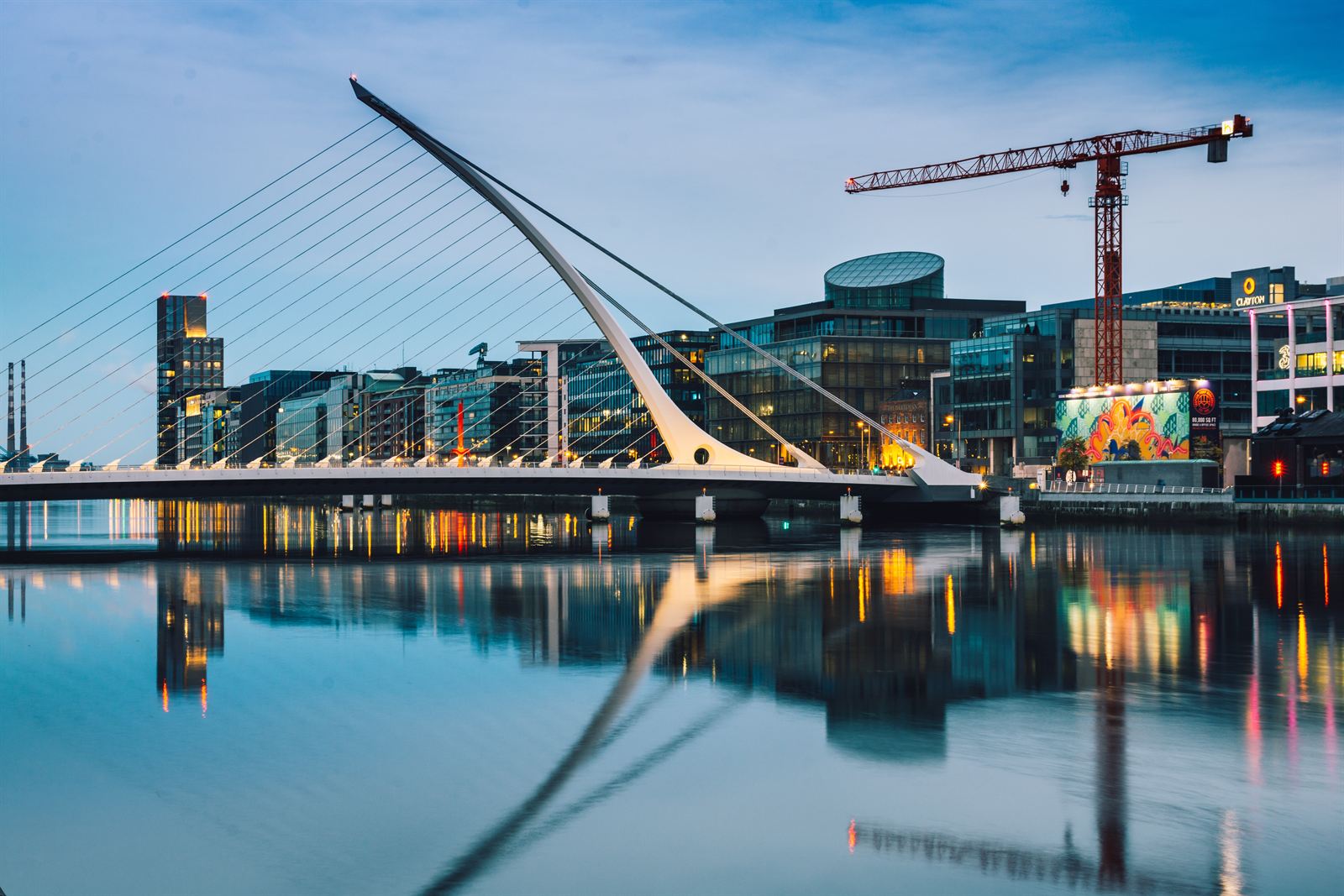 Samuel Beckett Bridge and Docklands buildings reflected in the River Liffey
