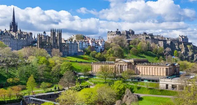 Edinburgh skyline with the Scott Monument spire, Old Town and castle above Princes Street Gardens