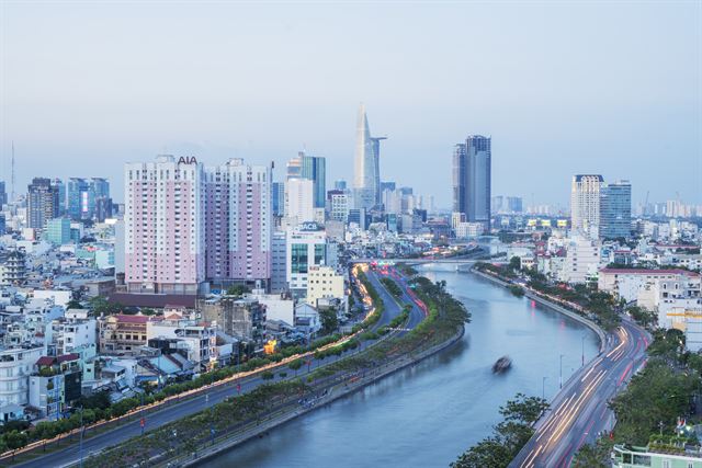 Tau Hu Canal curving through high-rise Ho Chi Minh City with the Bitexco tower