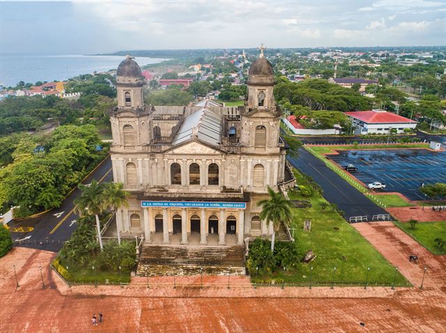 Aerial view of the ruined Old Cathedral of Managua with its twin towers near the shore of Lake Managua