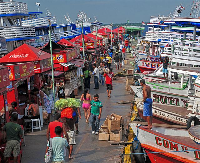 Busy dockside market and moored riverboats at the port of Manaus in the Amazon