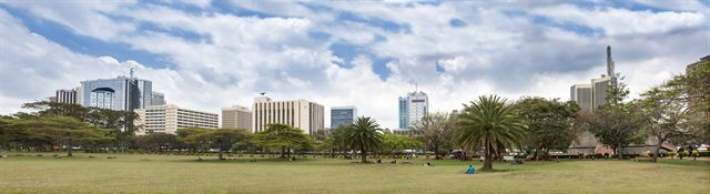Panorama of the Nairobi skyline and city center towers beyond a green park, Kenya