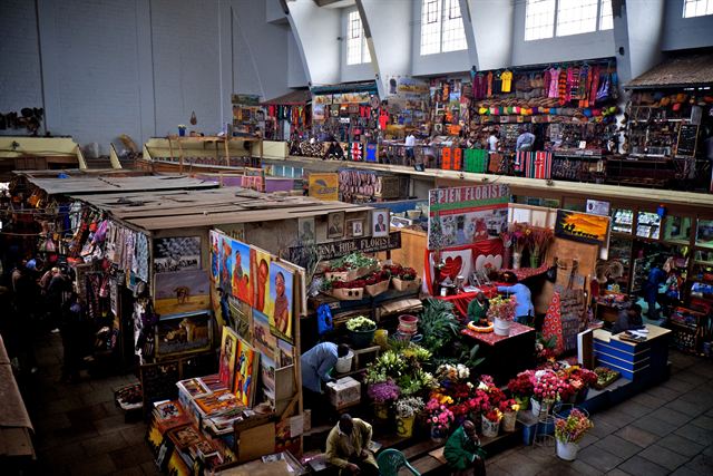 Flower and craft stalls inside the Nairobi City Market hall, Kenya