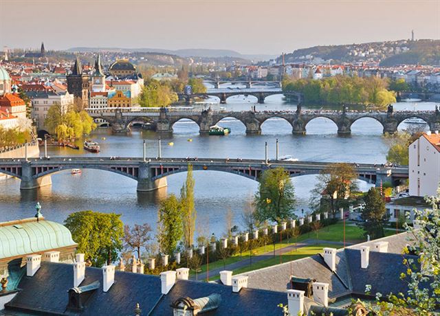 Series of bridges crossing the Vltava River through Prague with the Old Town skyline