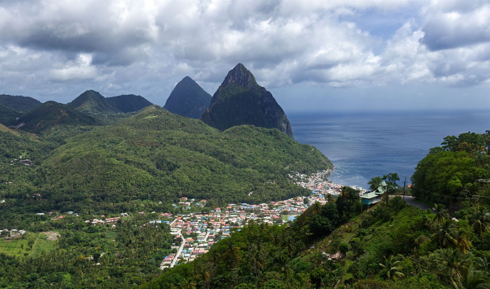 The twin Pitons rising above Soufriere town and its bay on Saint Lucia's green west coast