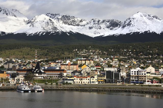 Ushuaia harbor and town below the snow-capped Martial Mountains, Tierra del Fuego, Argentina